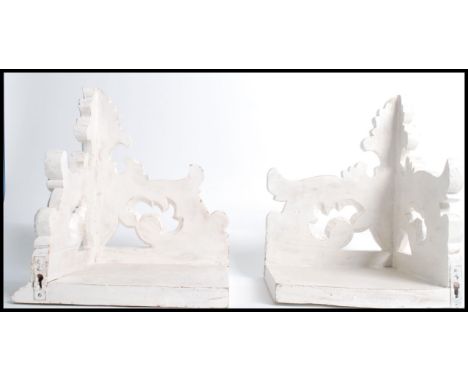 A pair of large 20th century rococo carved mahogany wall bracket corner shelves / clock brackets. Plinth tops with pierced an