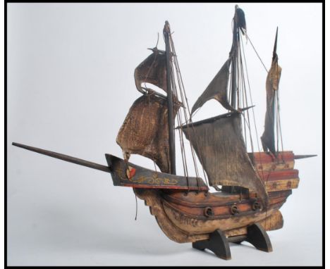 A vintage 20th century wooden model of a Spanish Galleon ship. Measures 53cms high.