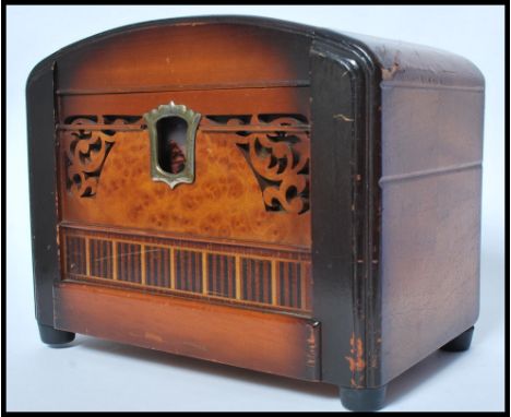 A vintage mid 20th century Made In Occupied Japan musical cigarette dispenser and lighter compendium box having a domed top w