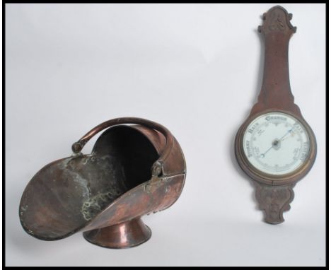 A vintage 20th century oak cased banjo aneroid barometer together with a good copper coal scuttle dating from the early 20th 