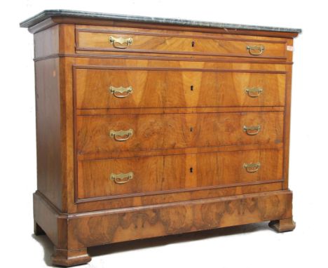 A 19th century French walnut  and black/grey veined marble commode chest of drawers being raised on bracket feet supports wit