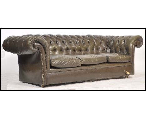 A good 20th century large leather button back Chesterfield sofa settee. Raised on brass oversized castors with green leather 