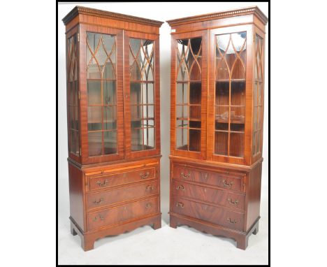 A good pair of Regency revival mahogany library bookcase cabinets. Each with bracket feet supporting a bank of drawers with p