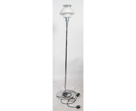 A retro / modernist standard lamp with chrome terraced base and column having frosted glass minimal shade atop
