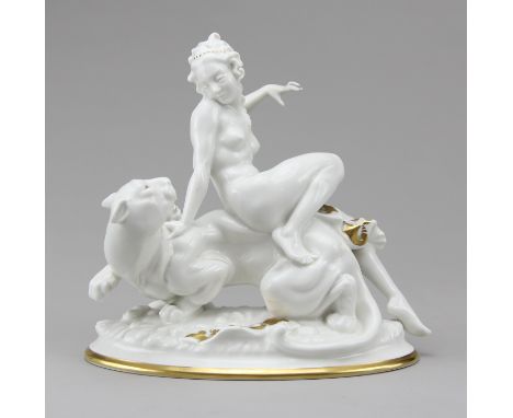 Hutschenreuther - Figur "Ariadne auf dem Panther"Porzellan gold staffiert, Frauenakt auf dem Rücken eines fauchenden Panthers