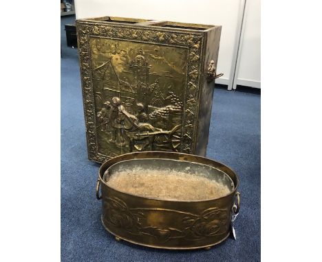 BRASS EMBOSSED STICK STAND, 52cm high, along with a brass planter (2)