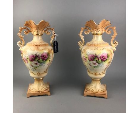 PAIR OF TWIN HANDLED VASES, with floral and gilt decoration, 41cm high, along with two ceramic female figures (4)