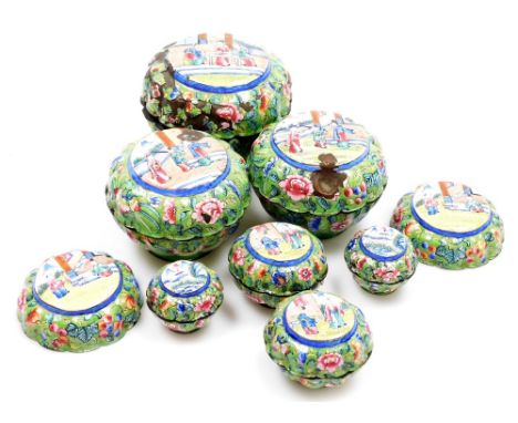 A graduated set of early 20thC Chinese Canton enamel jars and covers, each decorated with panels of figures to the lids, the 