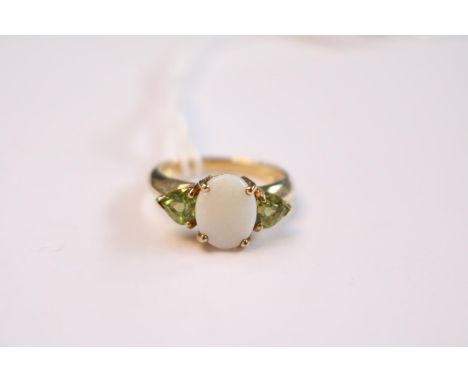 9ct Gold Ladies Oval Opal Claw set ring with Tri cut Peridot shoulders Size N. 3.8g total weight 