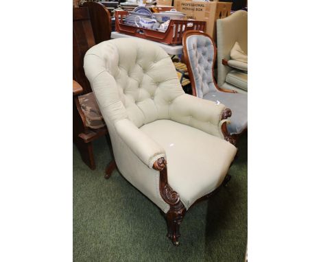 Victorian Button back upholstered Elbow chair with carved detail over scroll legs 