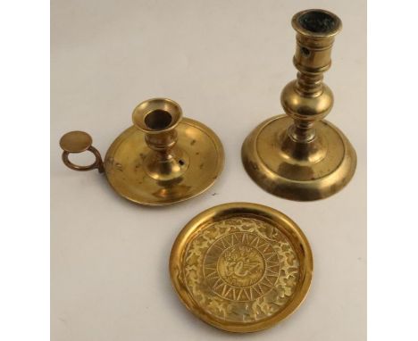 An Antique brass candlestick, on knopped column, height 6.25ins, together with a brass chamberstick and a brass dish