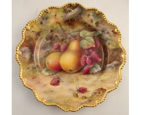 A Royal Worcester cabinet plate, decorated with fruit to a mossy background by T Lockyear, with shaped gilt edge, diameter 9i