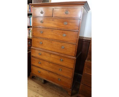 A 19th century mahogany chest of chest, the upper section fitted with two short over drawers three long graduated drawers, th