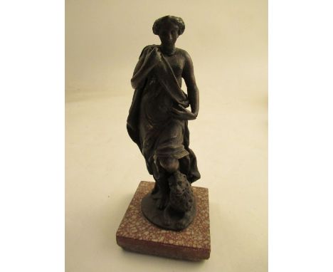 A metal study of a figure by a seated lion raised on a square tile&nbsp; height 7"