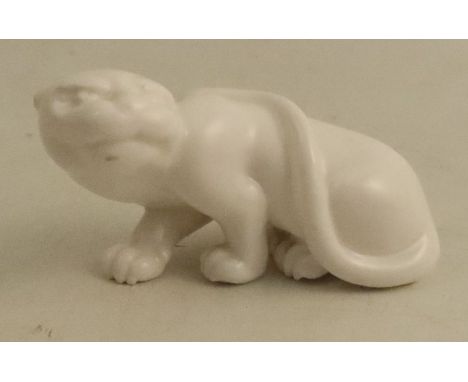 A Roya Worcester netsuke, modelled as white panther or a cheetah, height approx. 1.5ins - unglazed no obvious damage&nbsp;