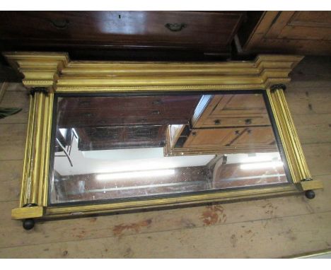 A Regency gilt frame over mantle mirror, width 56ins, height 28ins