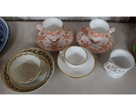 A pair of Wedgwood Aesthetic movement cups and saucers, af, together with a Minton cup and saucer marked to base " A present 