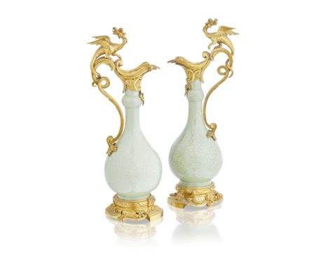 A pair of gilt bronze mounted Chinese green glazed porcelain ewers in the Louis XV tasteThe porcelain 18th century, the mount