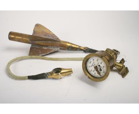 A Deck-Log instrument with ship's log,the brass Deck-Log instrument by Steger Jr. of Kiel, Germany, with white enamel dial, m