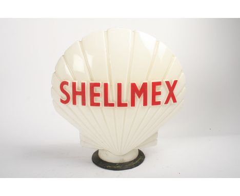 A 'Shellmex' glass petrol pump globe,by Hailware, lettered in red (faded), foot fitted with rubber ring, 45cm high. This lot 