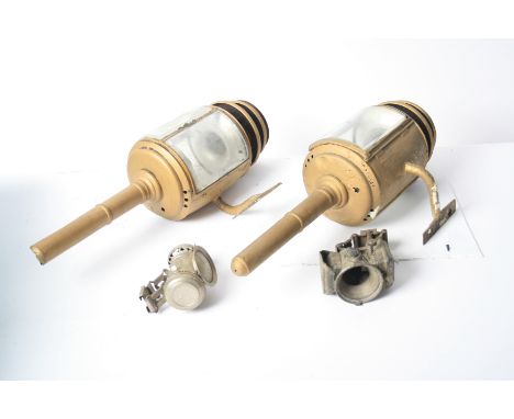 A pair of candle coach lamps,for restoration, each cylindrical body with three curved bevelled lenses (one broken), and overp