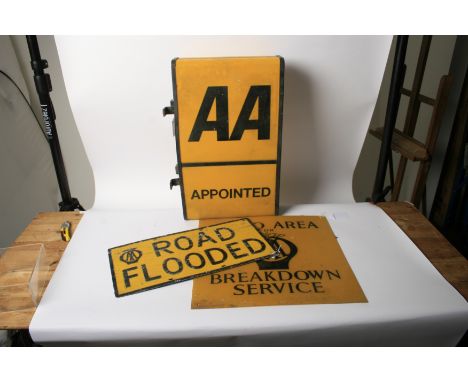 Three Automobile Association signs,comprising embossed alloy 'Road Flooded', 30.5 x 60.5cm; Plastic 'Radio Area for AA Breakd