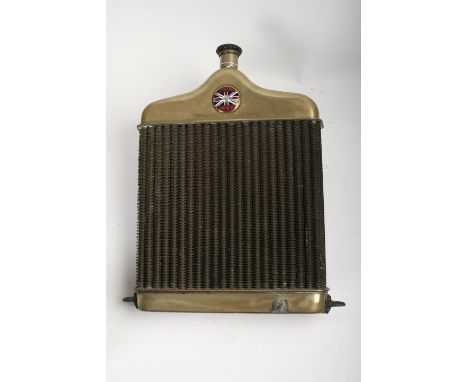A Standard Coventry radiator,nickel-plated surround with enamel badge, some chips and loss to enamel, finned tubular core wit