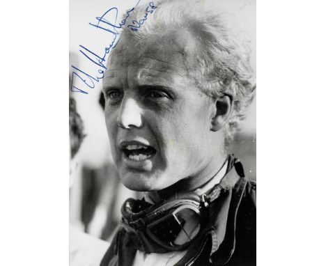 A signed photograph of Mike Hawthorn, dated 1958,6¼ x 4¼ inch monochrome portrait image of the driver with goggles, signed in