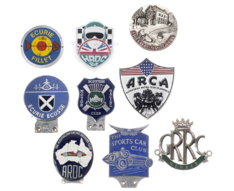 Nine racing themed car badges,comprising four enamel badges for Ecurie Ecosse by Premier Badges Ltd of London, Scottish Motor