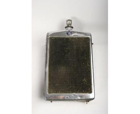 A Morris Light Van radiator,chrome-plated with enamel badge, some denting to surround, enamel chipped with loss, honeycomb co