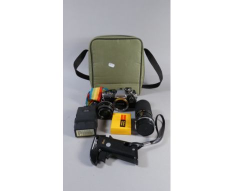 A Cased Olympus OM10 33mm Camera Together with Lens and Accessories 