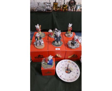 A Set of Seven Boxed Rupert Figures by Arden Sculptures, Together with a Rupert Bear Wall Clock by Wedgwood 