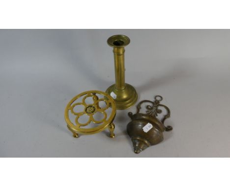 A Brass Rise and Fall Candle Stick, Circular Trivet Stand and Wall Hanging Stoup