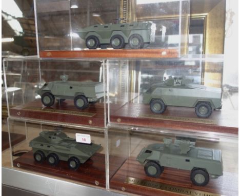 PROCUREMENT SERVICES INTERNATIONAL LTD; A SCALE MODEL OF AN ARMOURED VEHICLE, 'LAV-300APC' in a perspex case on a teak base, 