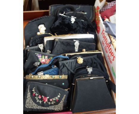 A LARGE COLLECTION OF LADIES' VINTAGE BLACK SATIN, SILK AND VELVET EVENING BAGS, with ornate clasp and some with embroidered 