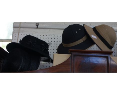 SONIA RYKIEL: A lady's colonial style hat, fawn with black trim, another in black with fawn trim and two lady's vintage black