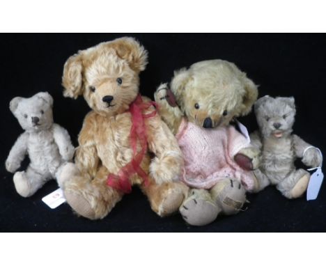 A VINTAGE MERRYTHOUGHT PLUSH TEDDY BEAR, with jointed limbs, 26cm high, two smaller Vintage bears, with jointed limbs and an 