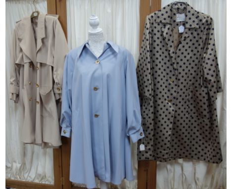 THE WHITE HOUSE: A light mocha rain mac with allover spotted decoration fashioned with three quarter length sleeves and faste