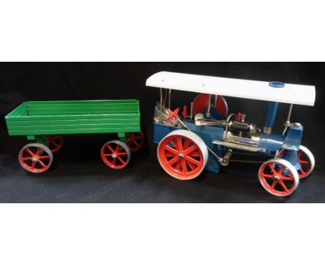 WILESCO; A STEAM TRACTION ENGINE, 'OLD SMOKEY' with blue paint work and a green trailer