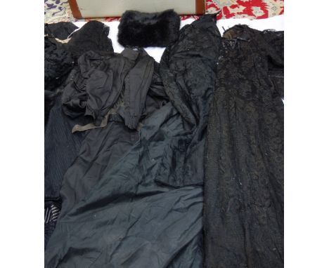 A LATE VICTORIAN LADIES BLACK JACKET, with lace trim, with matching full skirt, two muffs and similar Vintage clothing contai