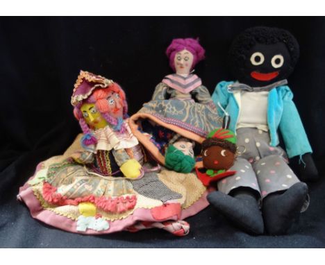 A VINTAGE GOLLY, a similar felt head, an 'Upside down' novelty woolen doll and a similar novelty 'Hat' doll with four faces (