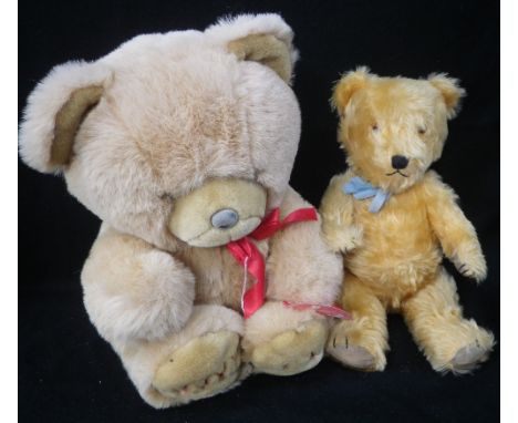 A 1950S PLUSH TEDDY BEAR with jointed limbs, 43cm high, believed to have been made by Chad Valley and a 'Wooly bear' from Woo