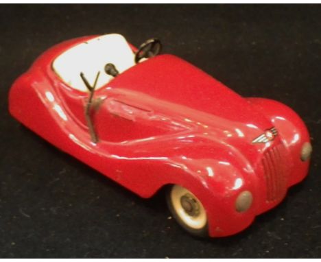 JIBBY; A VINTAGE TINPLATE CLOCKWORK OPEN CAR in red, made in Switzerland