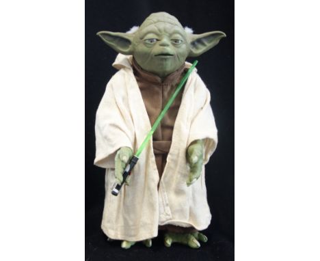 HASBRO; A STAR WARS BATTERY OPERATED YODA FIGURE  with light sabre