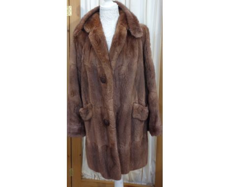 A LADY'S VINTAGE SINGLE BREASTED FUR COAT by M Michaels Furrier Ltd C. 1950's