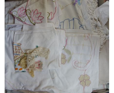 A COLLECTION OF VINTAGE EMBROIDERED BED COVERS, table cloths and napkins (as lotted)