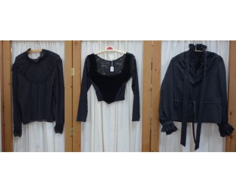 A LADY'S VINTAGE CORSET STYLE BLOUSE with black velvet boned front panel, the back and sleeves fashioned in black heavy net, 