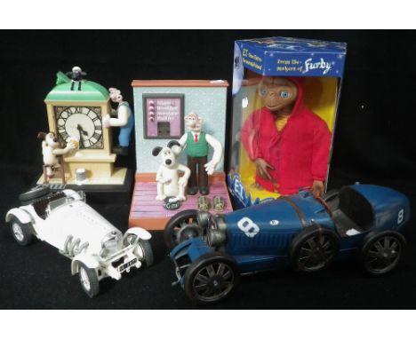 A WALLACE &amp; GROMIT CLOCK, a similar alarm clock, an E.T. boxed figure, a Burago model Mercedes- Benz Vintage sports car a