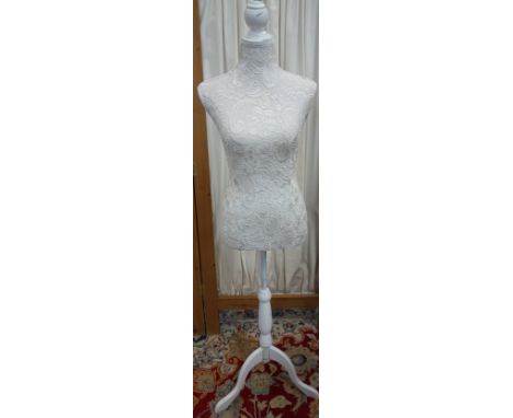 A CREAM SHOP MANNEQUIN with lace effect front on a white tripod stand