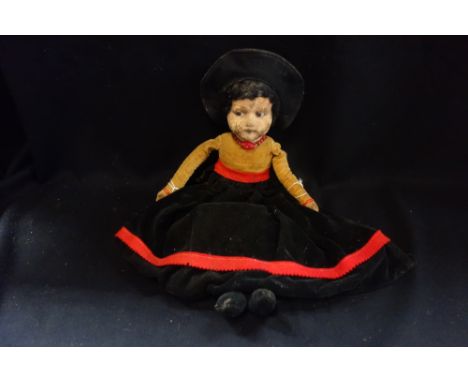 A VINTAGE NORAH WELLINGS DOLL with a painted face and velvet body, 52cm high